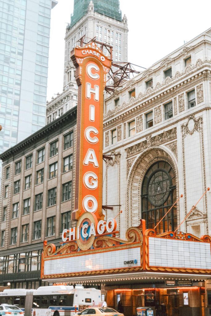 A vibrant view of the iconic Chicago Theatre marquee in downtown Chicago, showcasing urban architecture and culture.